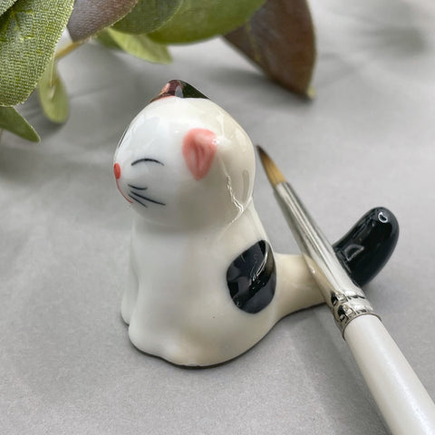 Cat brush rest