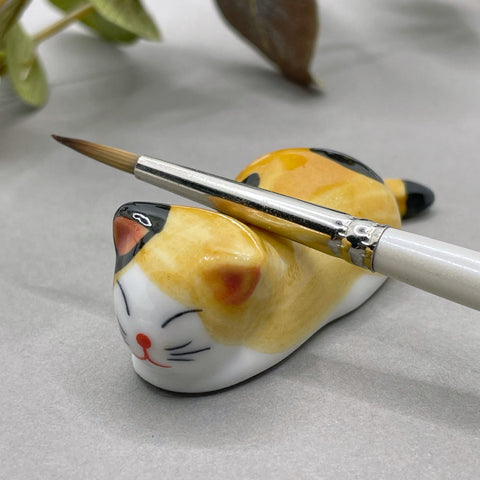 Cat brush rest
