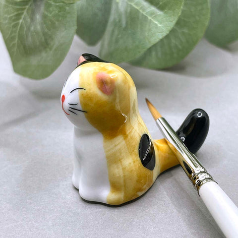 Cat brush rest